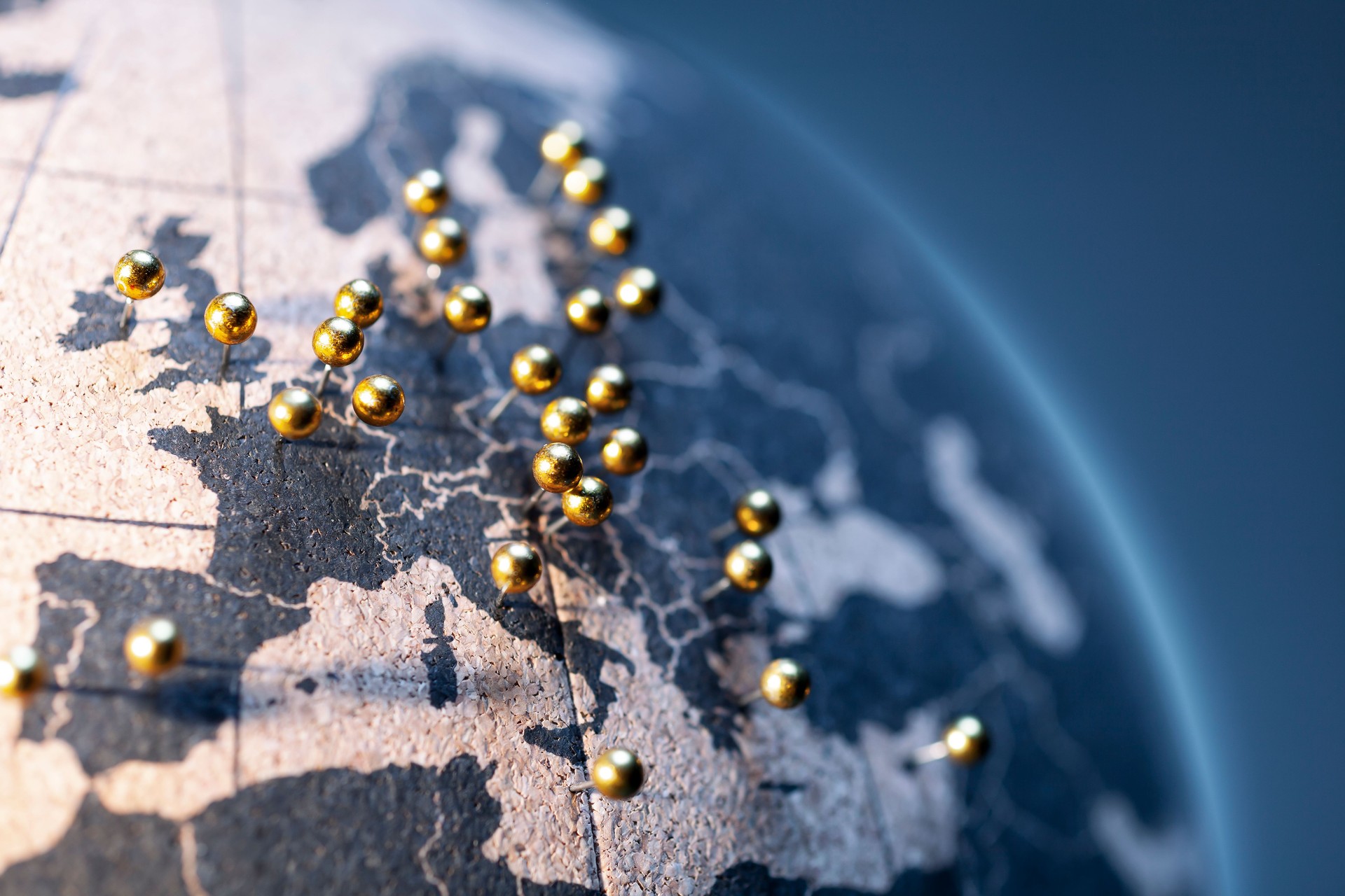 States and capitals of the European Union - Golden pins on cork board globe
